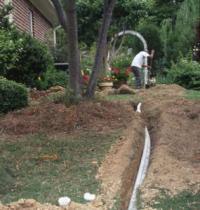 a tech installs a new pvc feed line