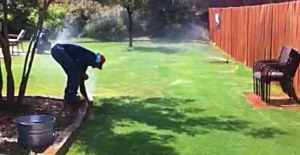one of our Richland Hills sprinkler repair specialists is fixing a sprinkler head