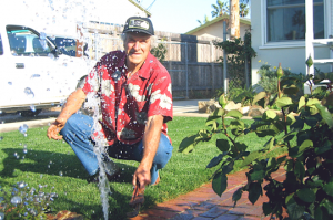 one of our Watauga sprinkler repair specialists is adjusting a sprinkler head